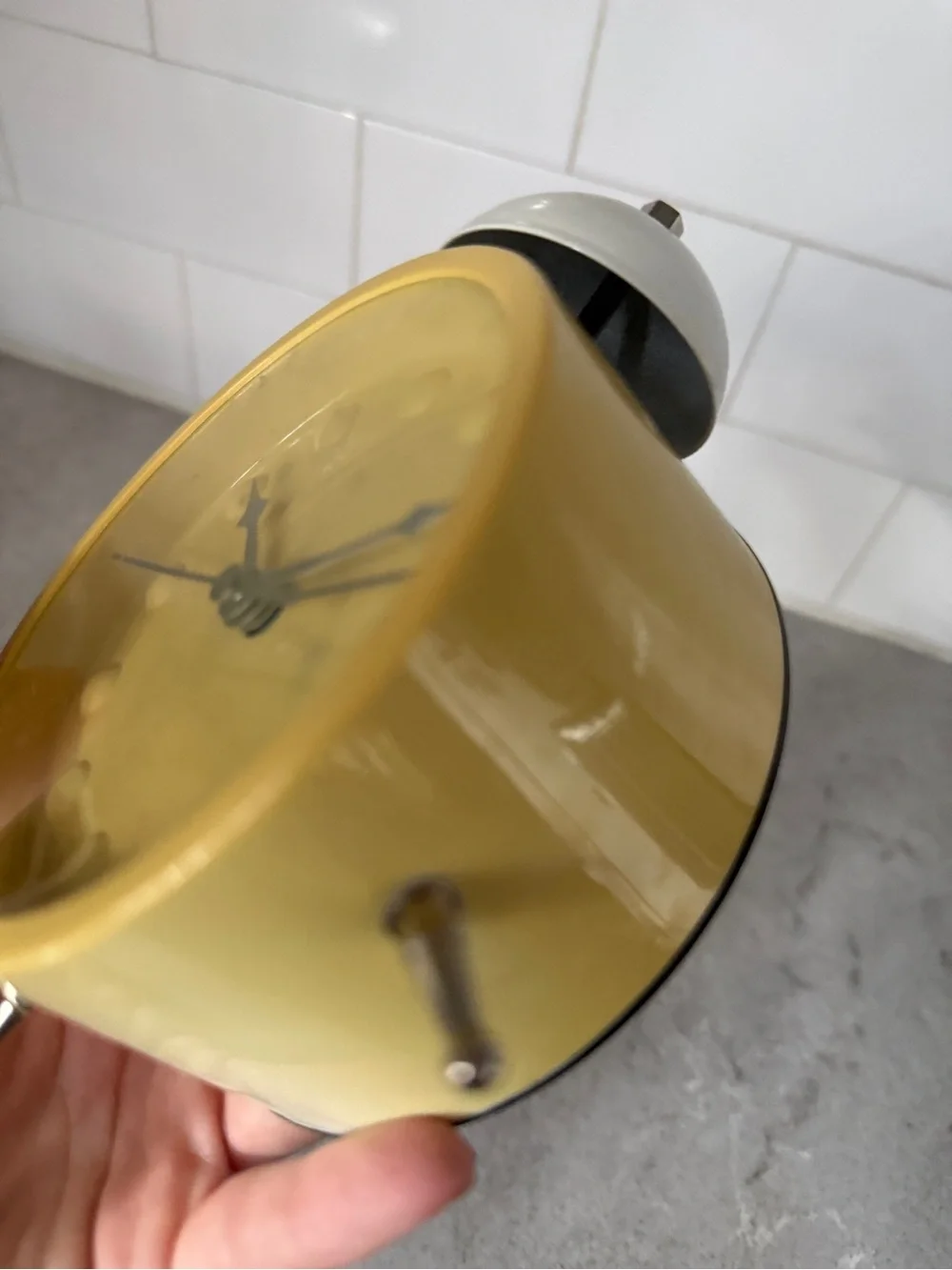 Vintage yellow Karlsson Chaplin alarm clock features a distinctive minimalist